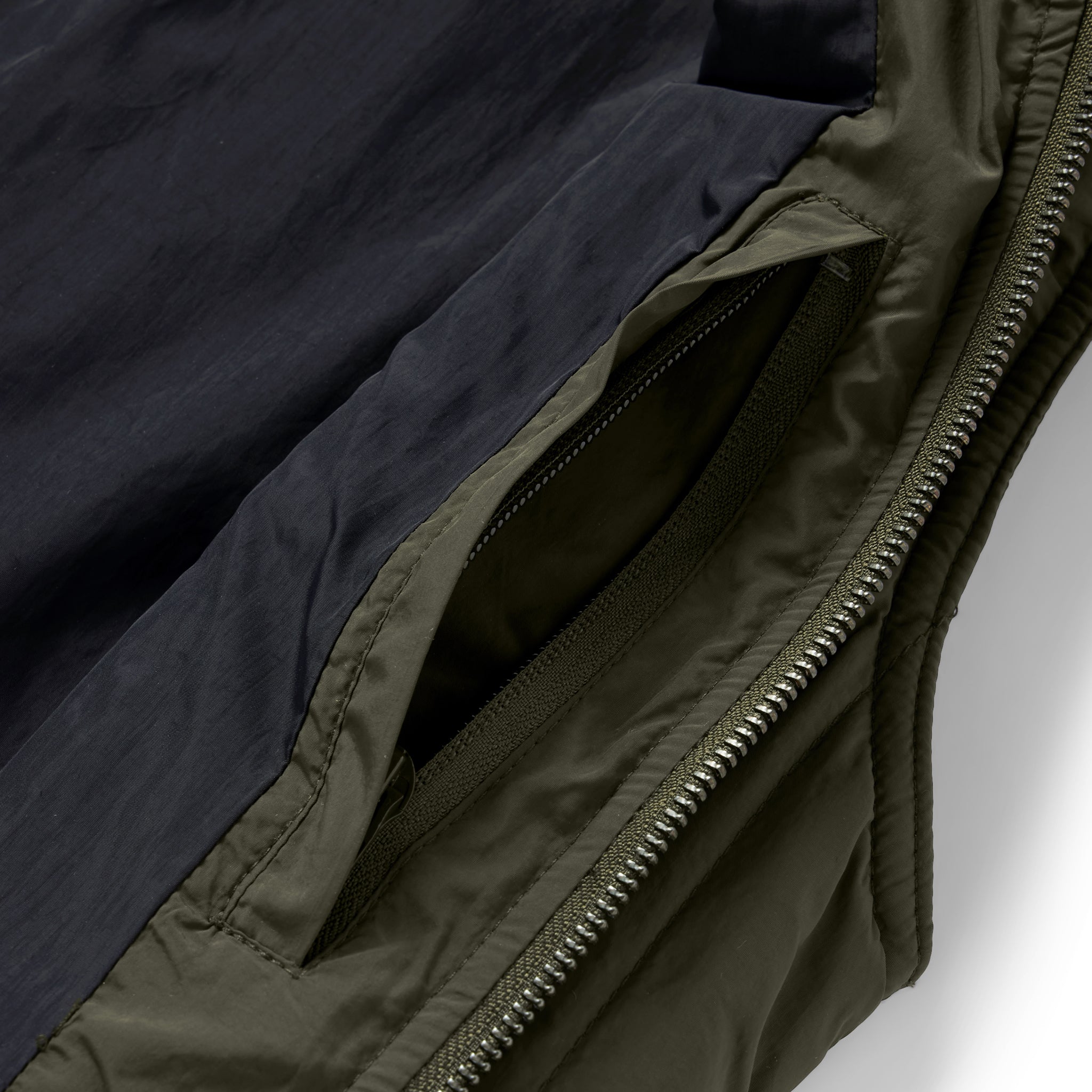 material shot of the interior pocket on The Able Vest in Quilted Army, Outerwear by Taylor Stitch