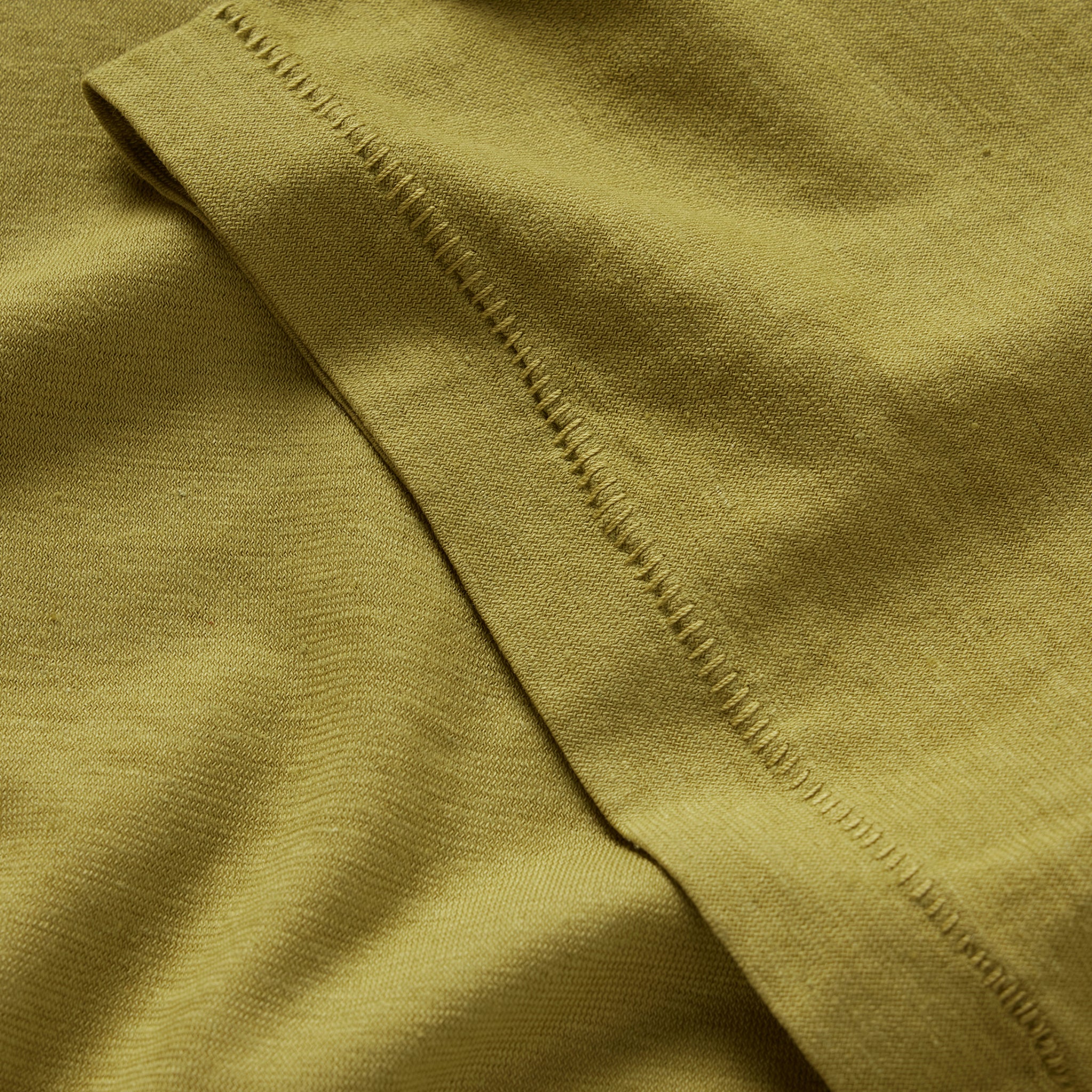material shot of the sleeve on The Cotton Hemp Tee in Juniper, Knits by Taylor Stitch