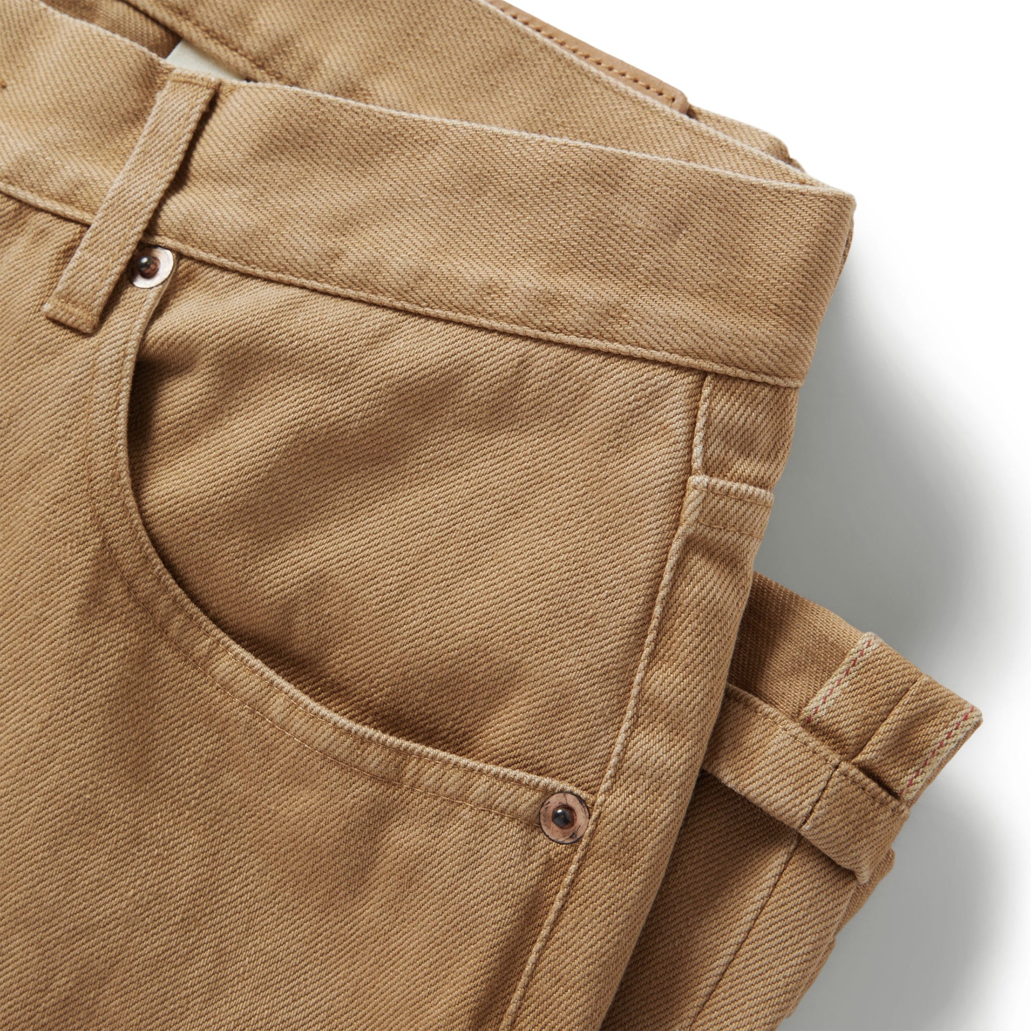 material shot of the front pockets on The Democratic All Day Pant in Washed Tobacco Selvage, Bottoms by Taylor Stitch