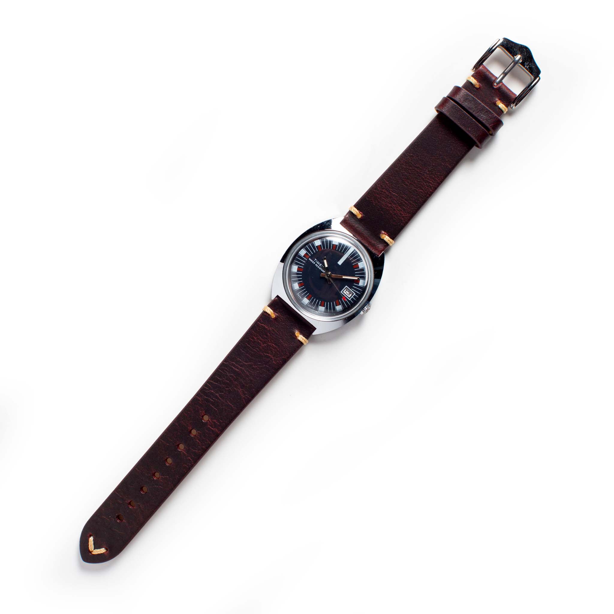flatlay of The 1973 Timex Marlin, Accessories by Taylor Stitch