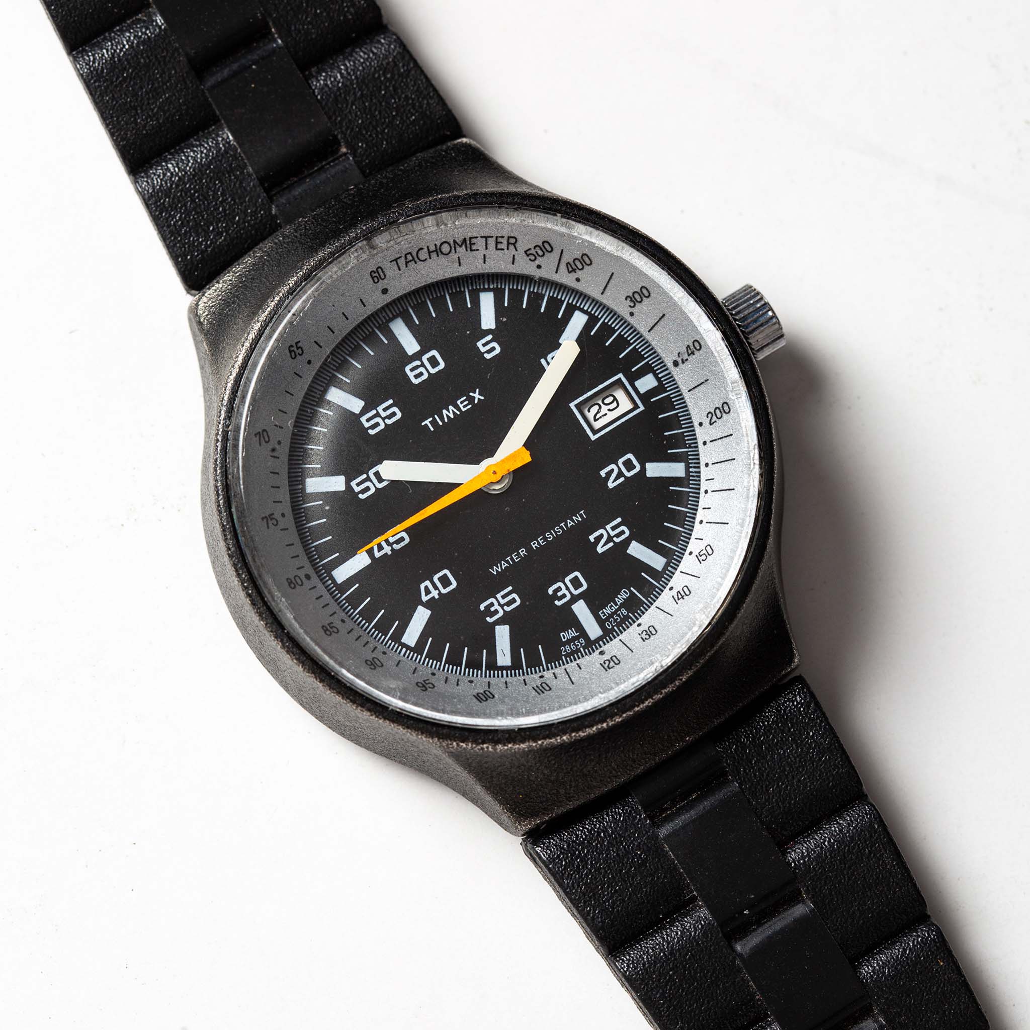 flatlay of the 1978 Timex Black Max, shown close up, Accessories by Taylor Stitch