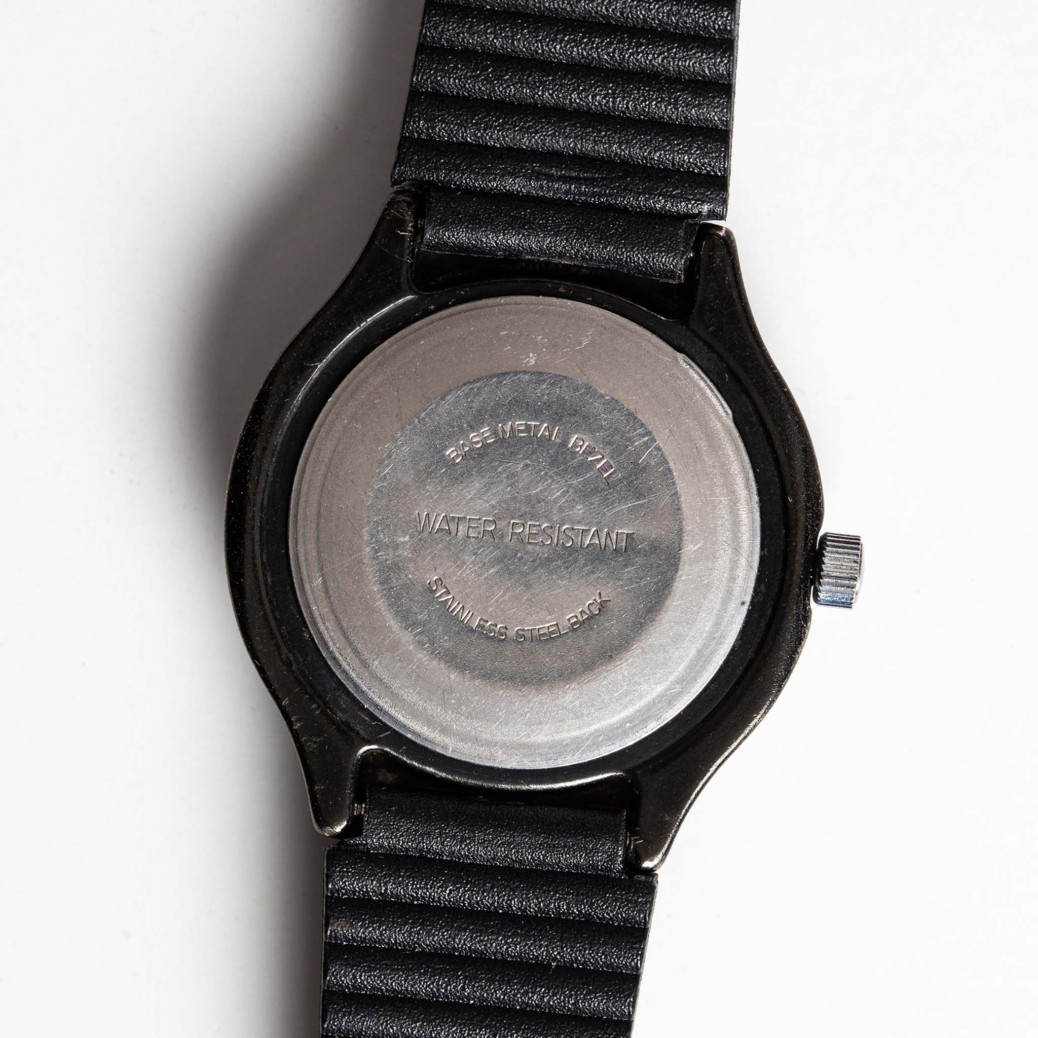 flatlay of the 1978 Timex Black Max, shown from the back, Accessories by Taylor Stitch