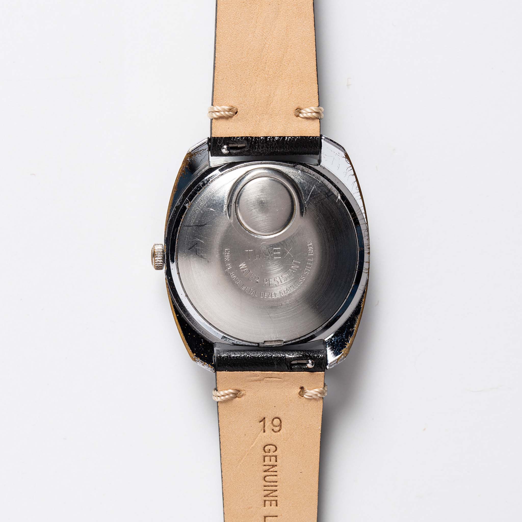 flatlay of 1975 Timex Electric Dynabeat "Rotary", from the back, Accessories by Taylor Stitch