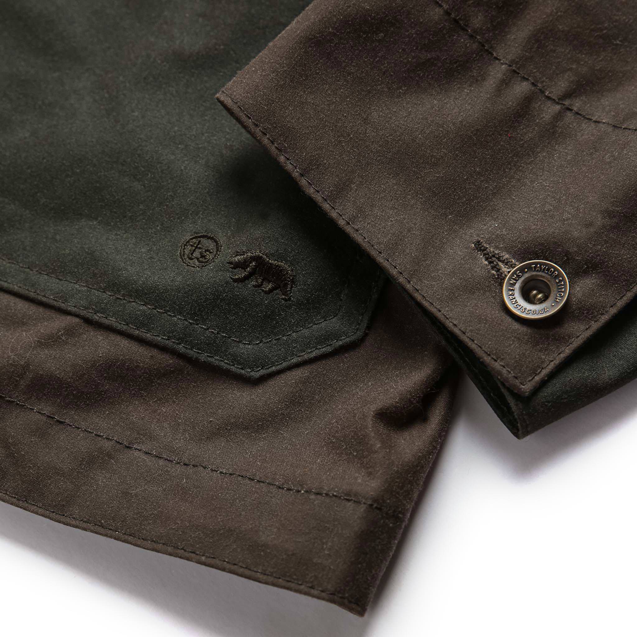 material shot of sleeve cuff of The Task Jacket in Waxed Khaki and Olive Patchwork, Outerwear by Taylor Stitch